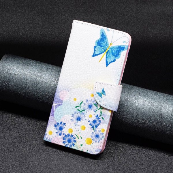 iPhone 14 Pro Fodral Motiv Fjärilar och Blommor