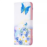 iPhone 14 Pro Max Fodral Motiv Fjärilar och Blommor