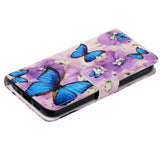 iPhone 15 Pro Fodral Motiv Lila Blommor Blåa Fjärilar
